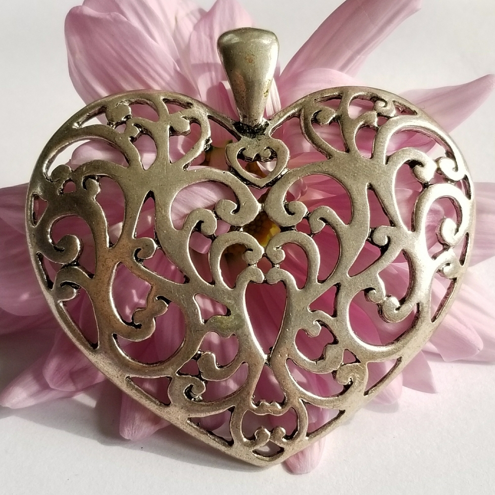 Scrolled heart pendant cut out design silver tone